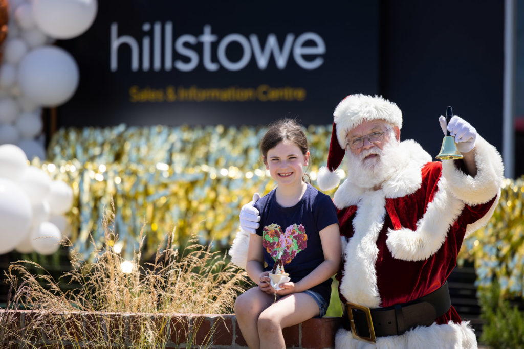 Hillstowe resident meets Santa outside the sales suite